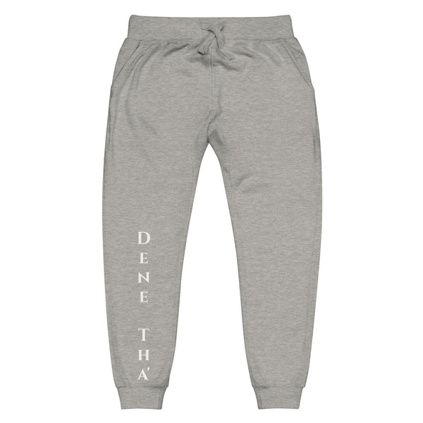 Front view of carbon grey joggers with White dene tha' lettering on front lower legs and white 1491 Apparel on the back pocket