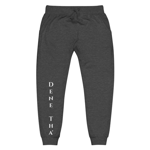 Front view of charcoal heather grey joggers with White dene tha' lettering on front lower legs and white 1491 Apparel on the back pocket