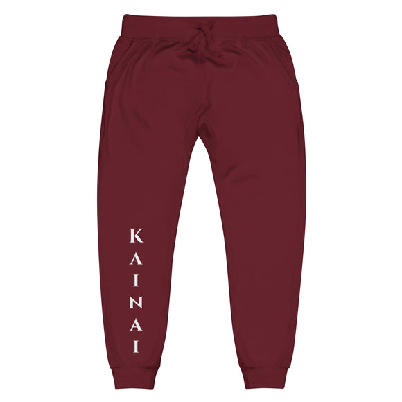 Front view of maroon joggers with White kainai lettering on front lower right leg and white 1491 Apparel on the back pocket