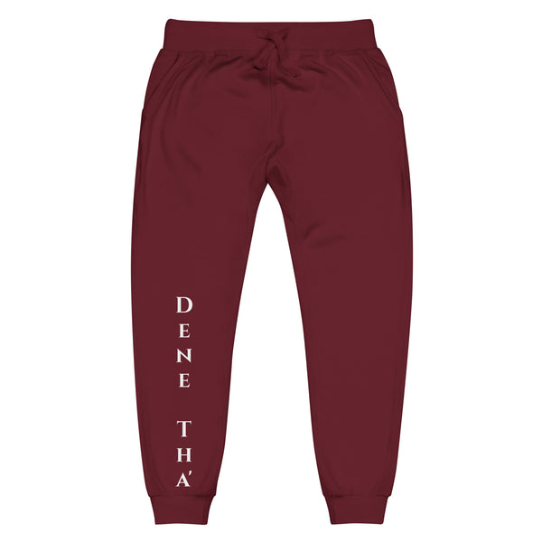 Front view of maroon joggers with White dene tha' lettering on front lower legs and white 1491 Apparel on the back pocket