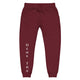 Front view of maroon joggers with White dene tha' lettering on front lower legs and white 1491 Apparel on the back pocket