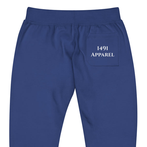 close up back view of team royal blue joggers with White haida lettering on front lower legs and white 1491 Apparel on the back pocket