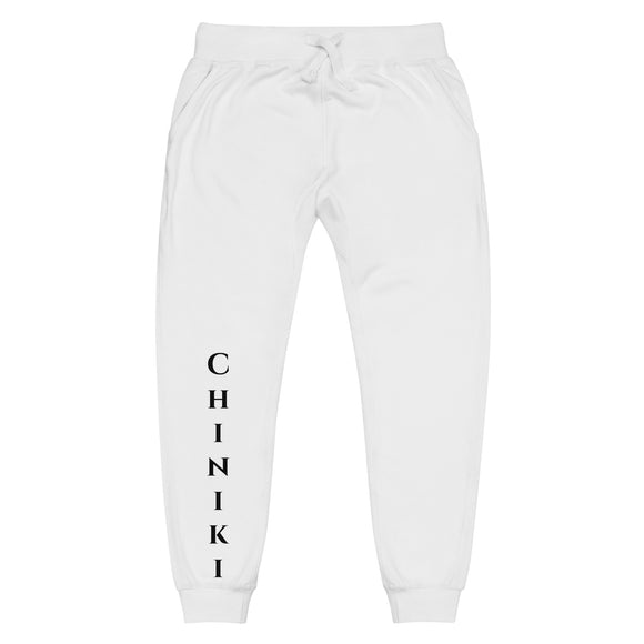 front view of white joggers with black Chiniki lettering on front lower right leg and black 1491 Apparel on the back pocket