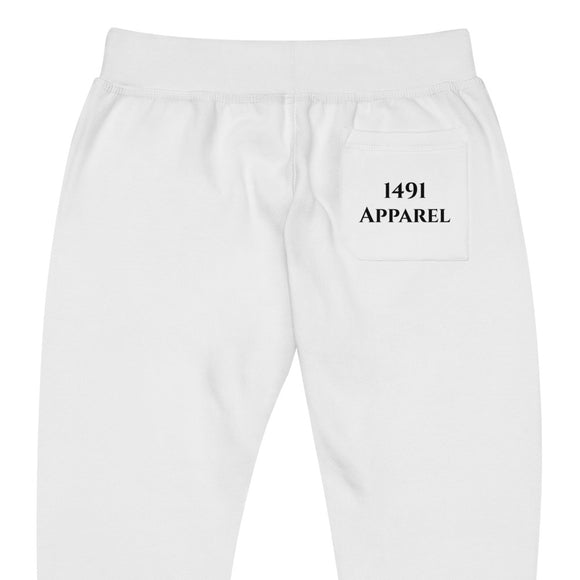 close up back view of white joggers with black iqaluit lettering on front lower right leg and black 1491 Apparel on the back pocket